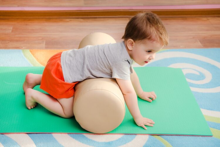 Baby Yoga: The Benefits and How to Get Started 52 Optimized little kid is engaged sports gym 1