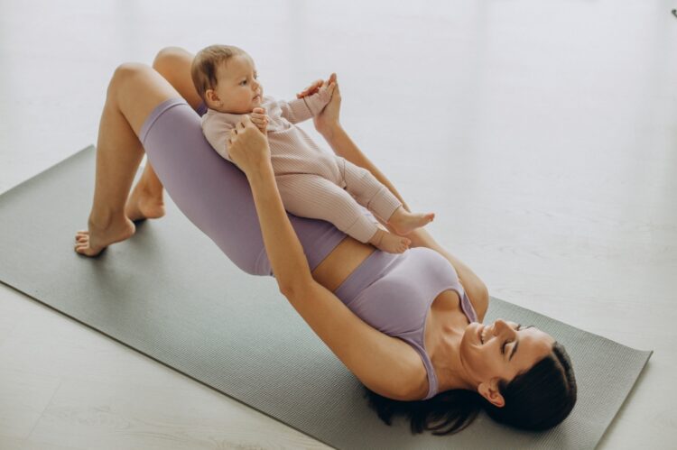 Baby Yoga: The Benefits and How to Get Started 51 Optimized mother with her baby daughter practice yoga home