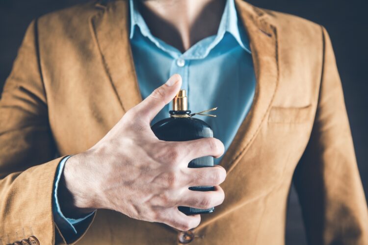 Scented Elegance: A Fragrance Guide for Every Occasion 53 Optimized young business man hand perfume