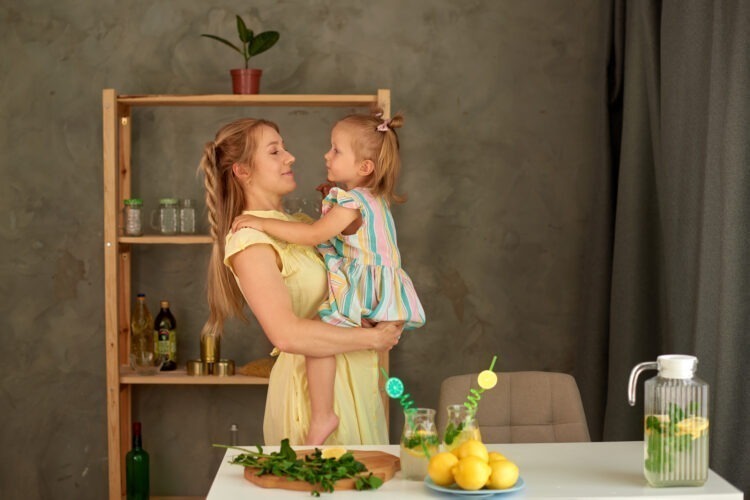 A Taste of Growing Up: Tips for Introducing Solid Foods to Your Baby 52 love cooking cute mother little daughter make summer lemon drink kitchen happy hugs