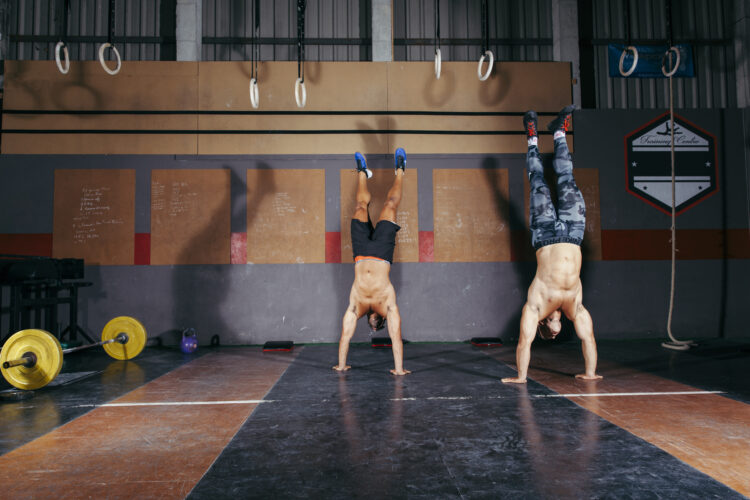 Ascend to Power: Mastering the Art of Upper Body Strength with Calisthenics 51 men doing handstands
