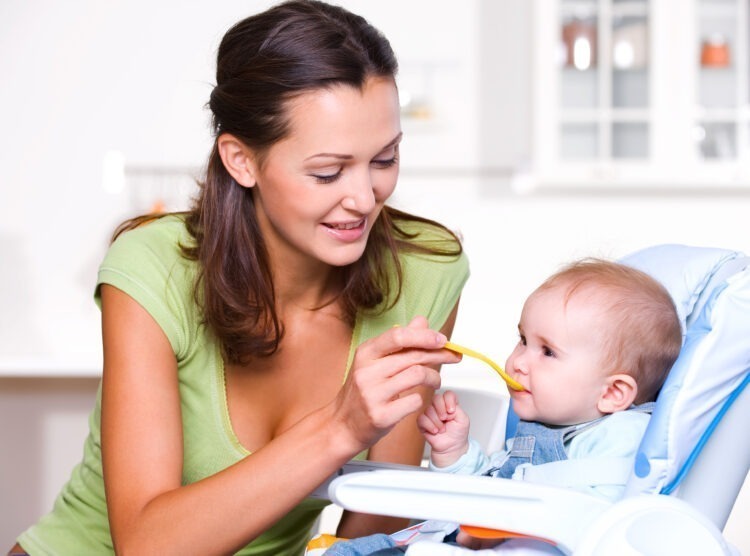 A Taste of Growing Up: Tips for Introducing Solid Foods to Your Baby 51 mother feeding hungry baby