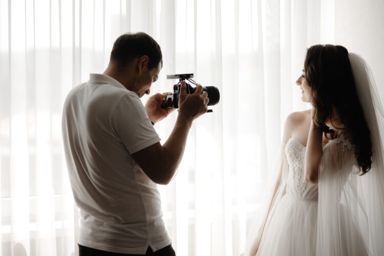 Capturing Everlasting Love: Mastering the Art of Wedding Photography 51 photographer takes photo bride wedding dress