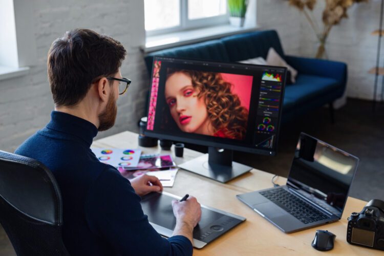 Mastering Photoshop: A Comprehensive Guide to Editing Photos from Retouching to Compositing 51 retouching images special program portrait graphic designer working office with laptop monitor graphic drawing tablet color palette retoucher workplace photo studio creative agency